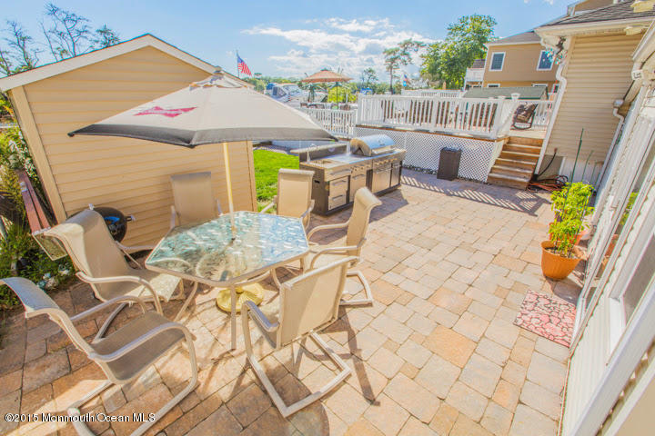 623 Bancroft Road Brick, NJ 08724 - Photo 25 of 91 a view of a patio with a table and chairs