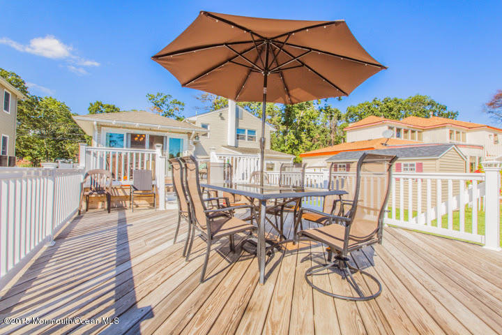 623 Bancroft Road Brick, NJ 08724 - Photo 26 of 91 a view of a patio with a table and chairs under an umbrella