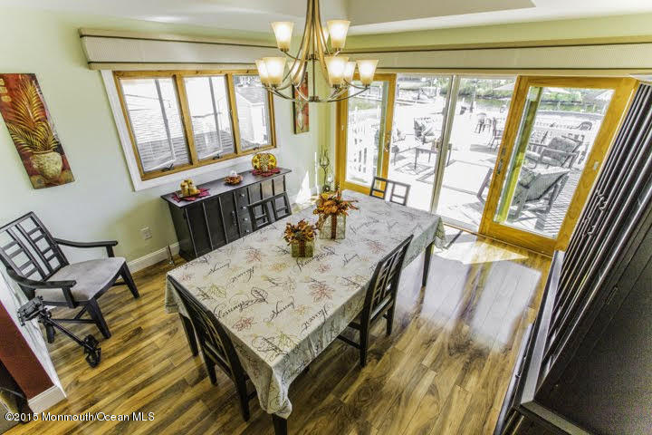 623 Bancroft Road Brick, NJ 08724 - Photo 4 of 91 a view of a dining room with furniture a chandelier and wooden floor
