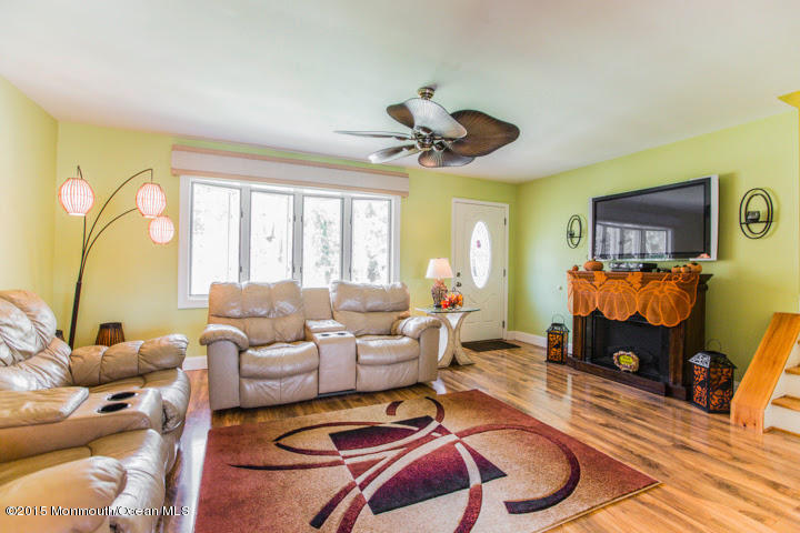 623 Bancroft Road Brick, NJ 08724 - Photo 44 of 91 a living room with furniture a flat screen tv and a large window