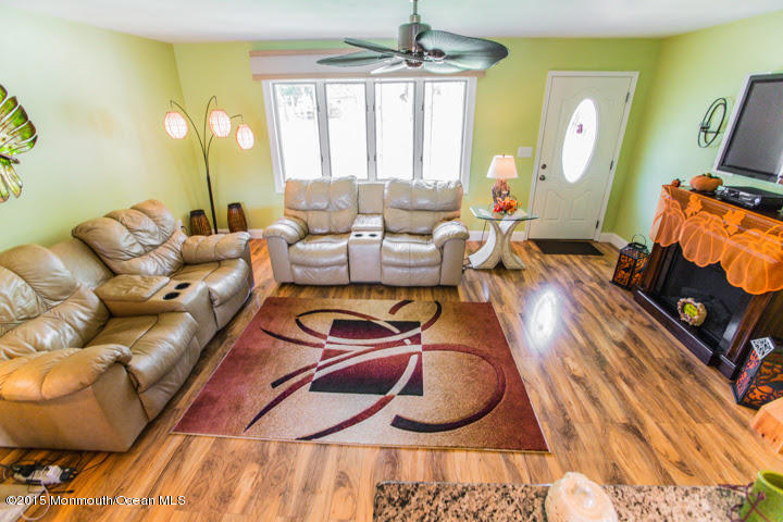 623 Bancroft Road Brick, NJ 08724 - Photo 47 of 91 a living room with furniture and a chandelier