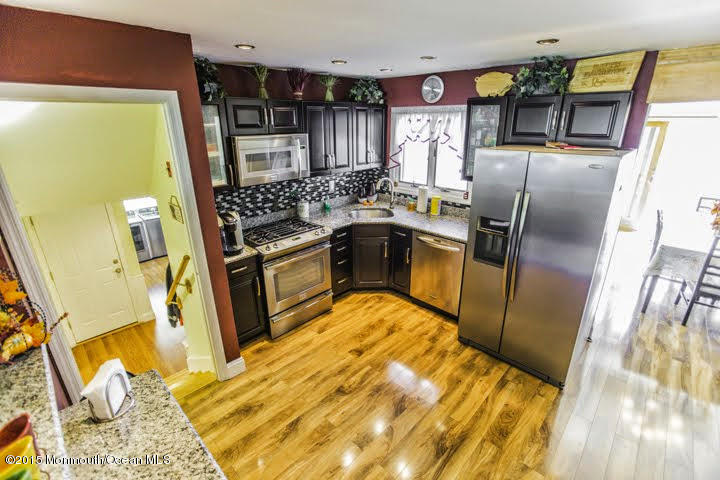 623 Bancroft Road Brick, NJ 08724 - Photo 55 of 91 a kitchen with stainless steel appliances granite countertop a refrigerator a stove and a sink