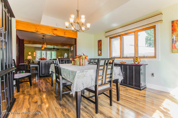623 Bancroft Road Brick, NJ 08724 - Photo 64 of 91 a view of a dining room with furniture a chandelier and wooden floor