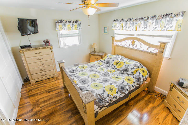 623 Bancroft Road Brick, NJ 08724 - Photo 69 of 91 a bedroom with a bed and flat screen tv