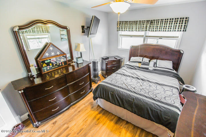 623 Bancroft Road Brick, NJ 08724 - Photo 78 of 91 a bedroom with a bed and wooden floor