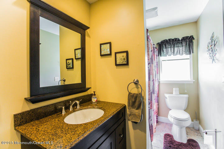 623 Bancroft Road Brick, NJ 08724 - Photo 79 of 91 a bathroom with a granite countertop sink and a mirror