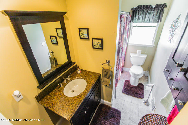 623 Bancroft Road Brick, NJ 08724 - Photo 80 of 91 a bathroom with a sink mirror vanity and toilet