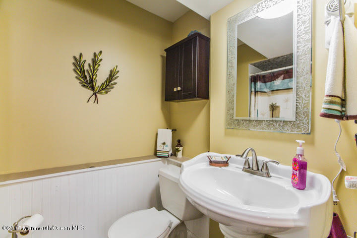 623 Bancroft Road Brick, NJ 08724 - Photo 81 of 91 a bathroom with a sink a toilet and mirror