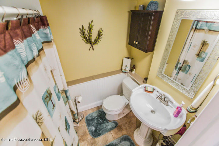 623 Bancroft Road Brick, NJ 08724 - Photo 83 of 91 a bathroom with a sink and a mirror