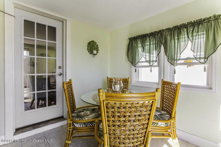623 Bancroft Road Brick, NJ 08724 - Photo 86 of 91 a dining room with furniture and a floor to ceiling window