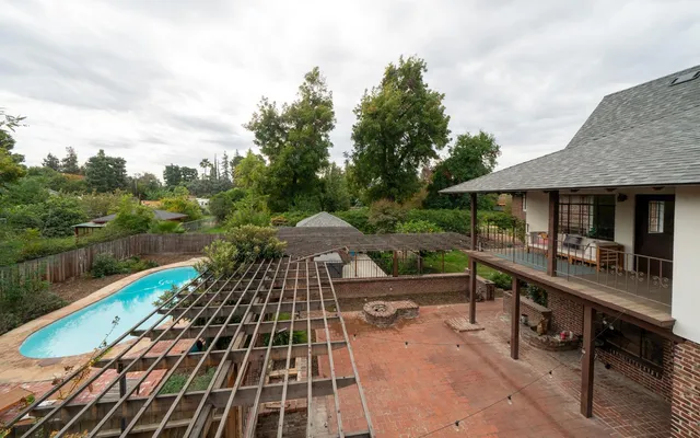 a view of a patio with chairs and a yard