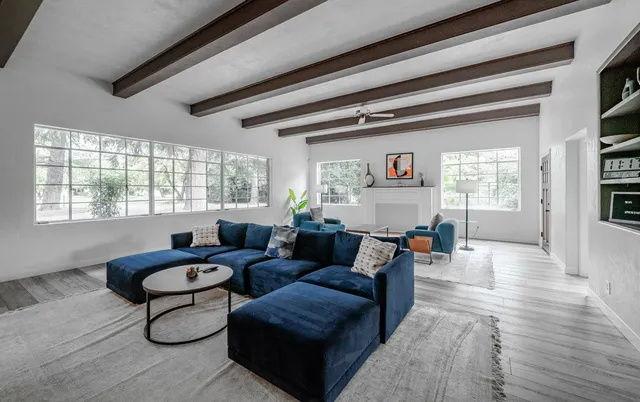 a living room with furniture and a window