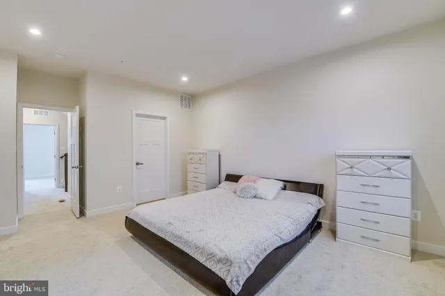 a bedroom with a bed and a cabinets