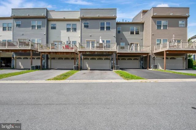 a view of a swimming pool with outdoor seating