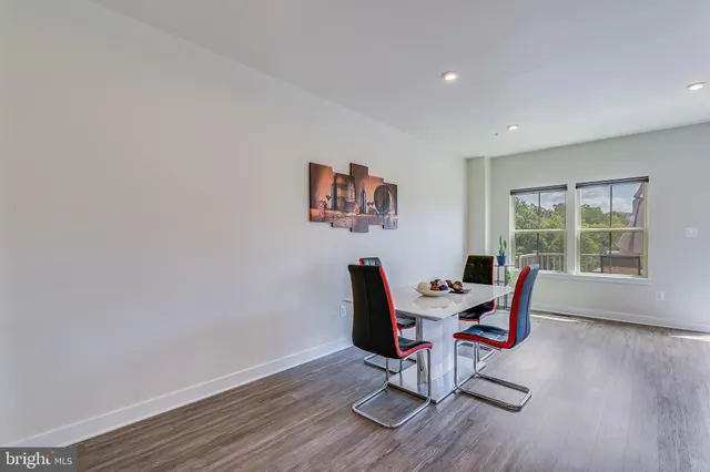 a work room with furniture and wooden floor
