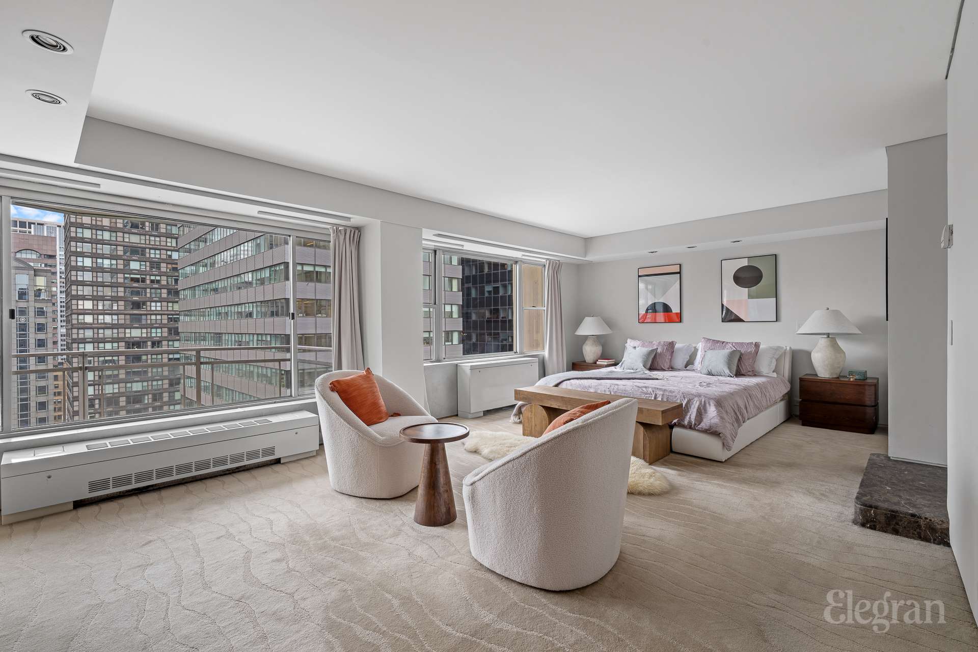 118 East 60th Street, Unit 33/32 DUPLEX Manhattan, NY 10022 - Photo 15 of 23 a living room with furniture and a large window