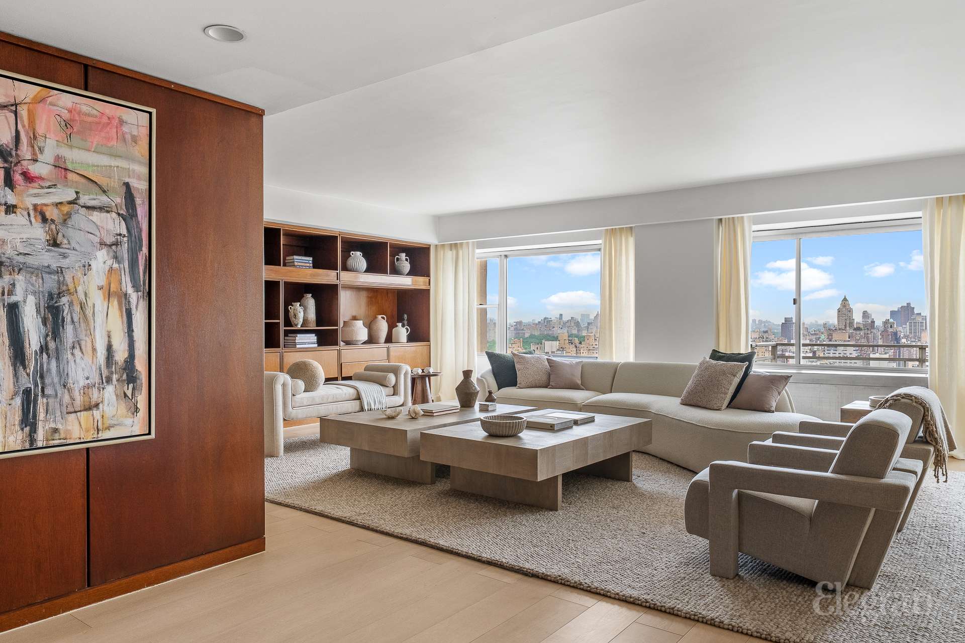 118 East 60th Street, Unit 33/32 DUPLEX Manhattan, NY 10022 - Photo 2 of 23 a living room with furniture and a large window