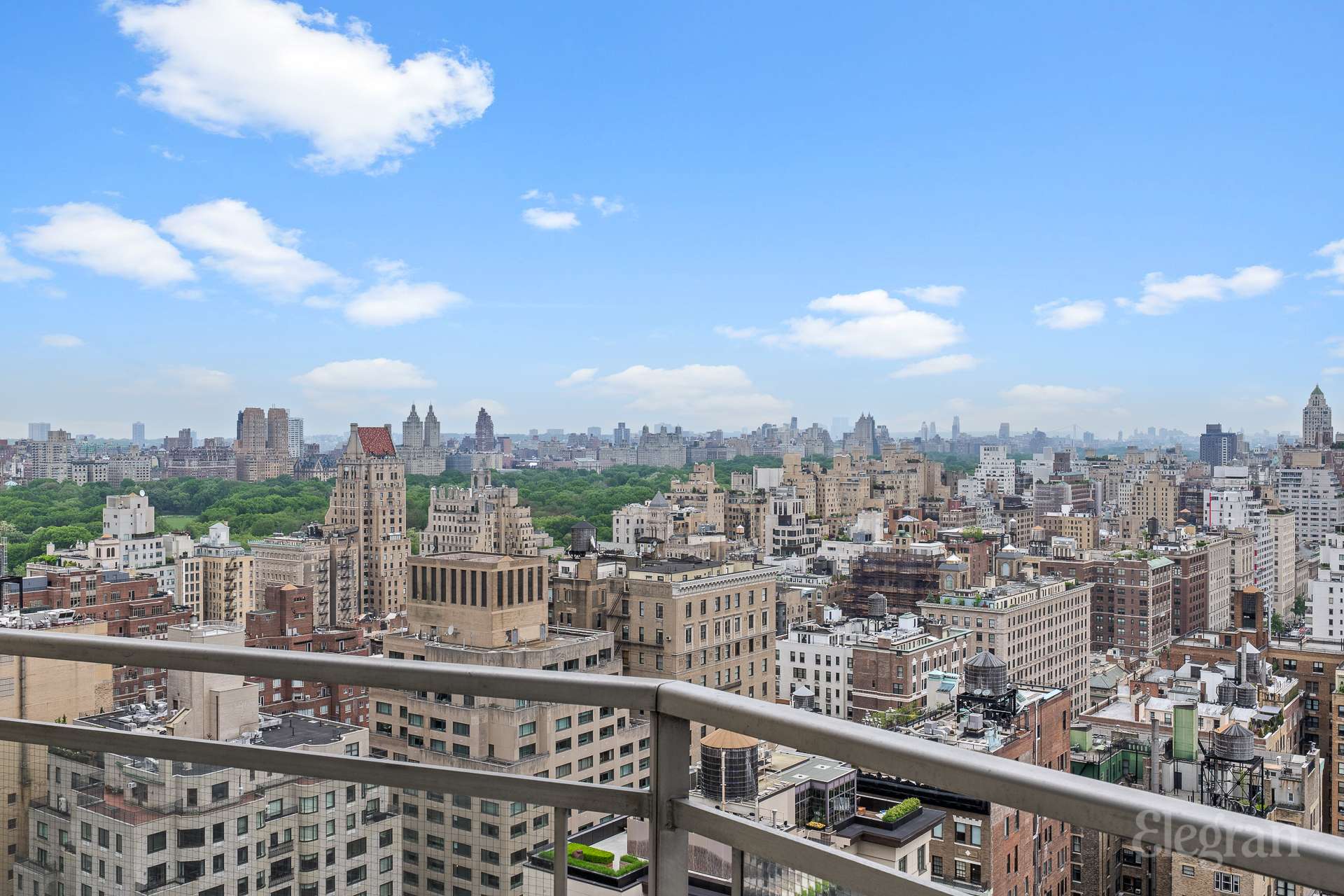 118 East 60th Street, Unit 33/32 DUPLEX Manhattan, NY 10022 - Photo 3 of 23 a view of a city skyline from a balcony
