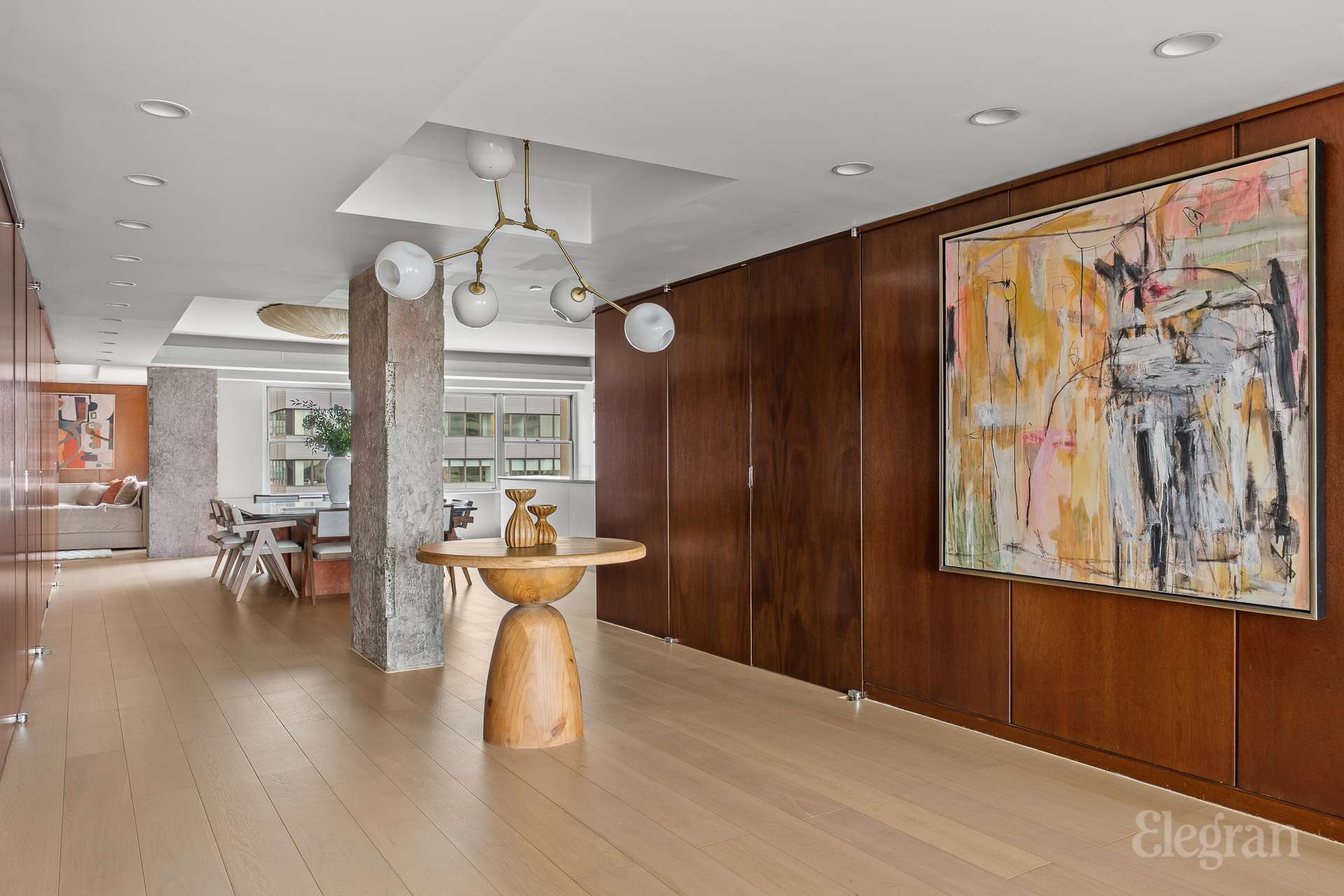 118 East 60th Street, Unit 33/32 DUPLEX Manhattan, NY 10022 - Photo 6 of 23 a view of a livingroom with furniture window and wooden floor