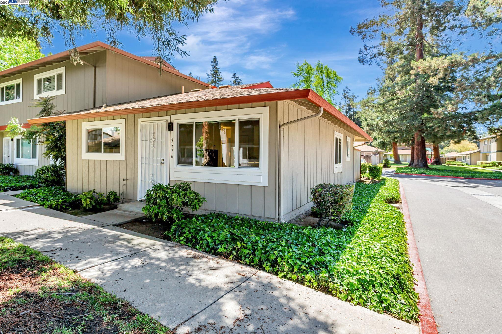 3570 Dalton Common Fremont, CA 94536 - Photo 1 of 1 a front view of a house with garden