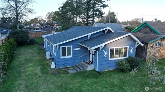 a aerial view of a house with a yard