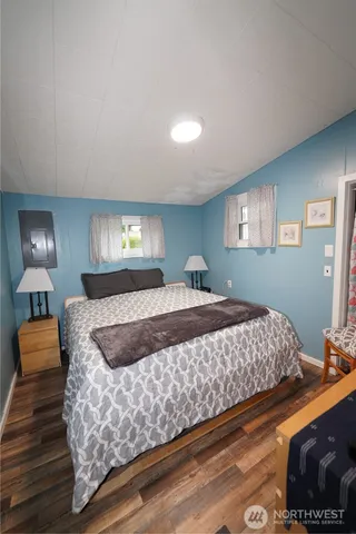 a bedroom with a bed and window