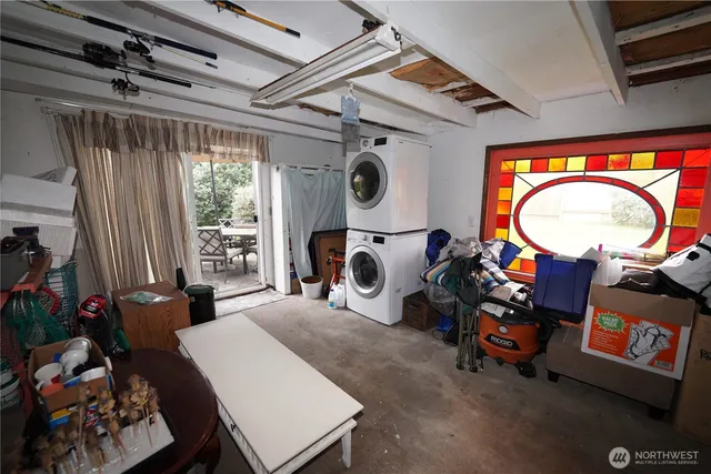 a living room with furniture a rug and a window