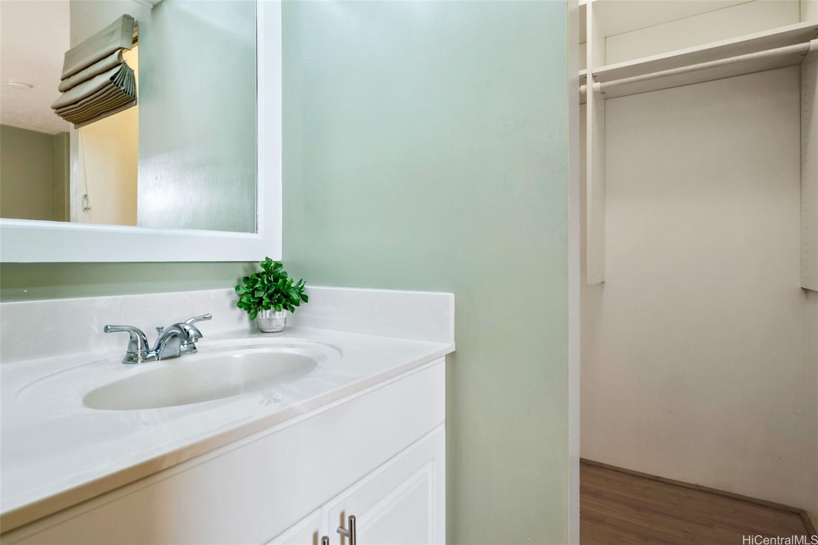 1505 Alexander Street, Unit 206 Honolulu, HI 96822 - Photo 11 of 20 a bathroom with a sink and a mirror