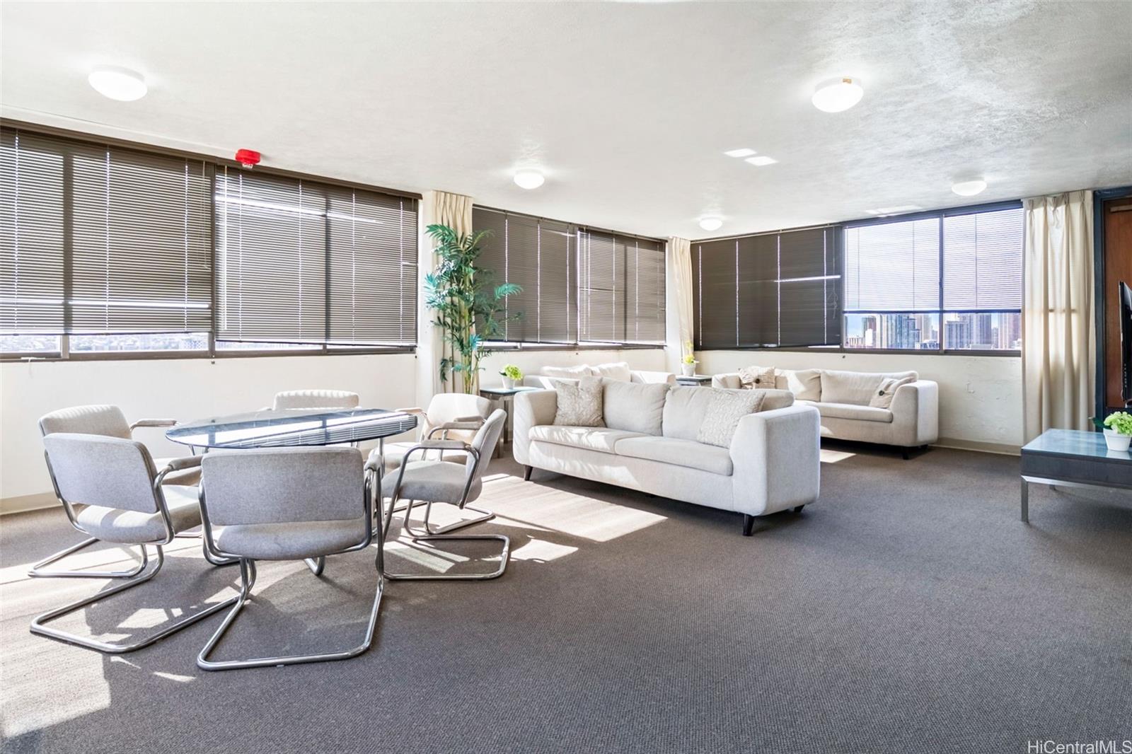 1505 Alexander Street, Unit 206 Honolulu, HI 96822 - Photo 14 of 20 a living room with furniture and a large window