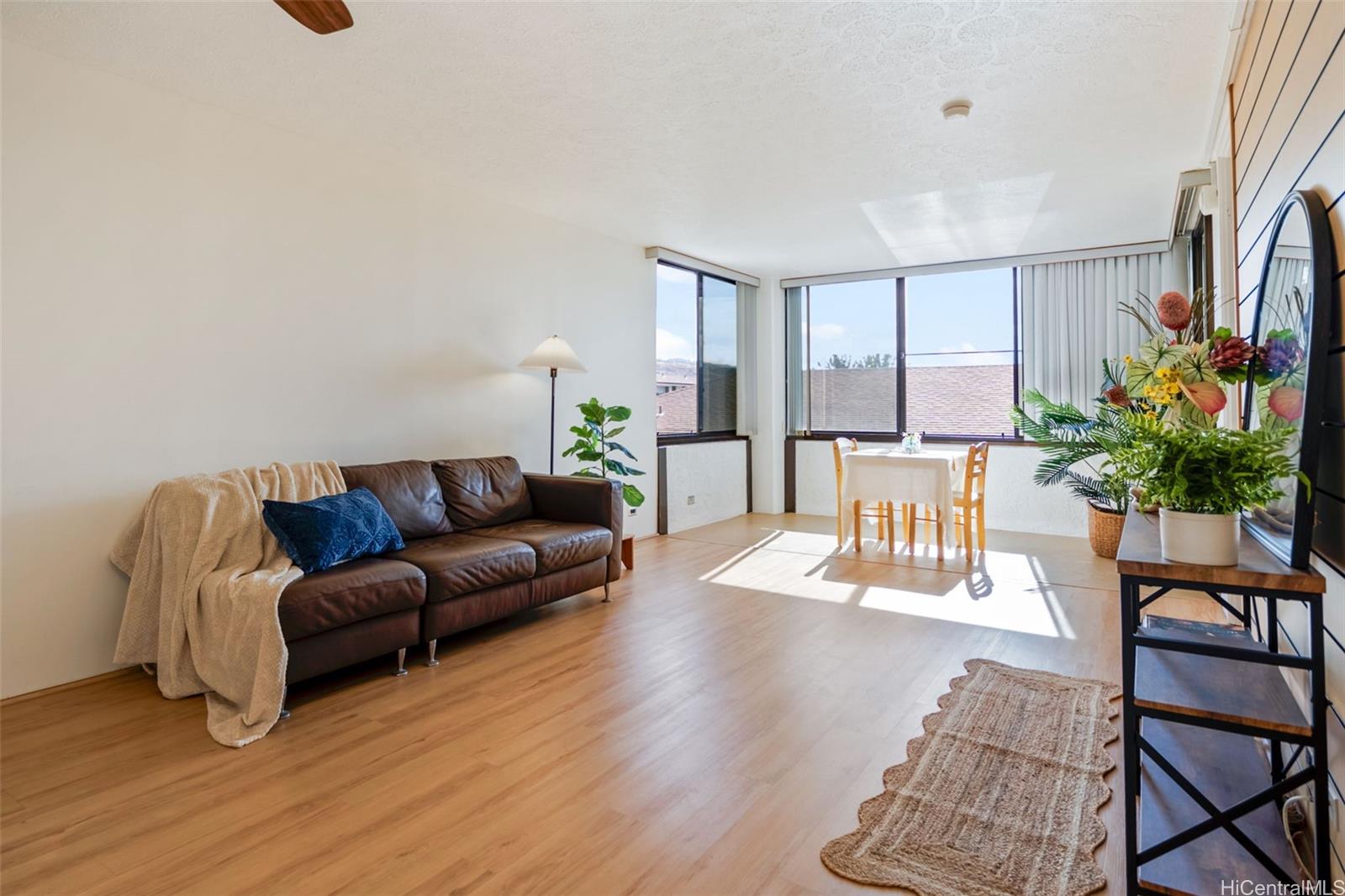 1505 Alexander Street, Unit 206 Honolulu, HI 96822 - Photo 2 of 20 a living room with furniture and a potted plant