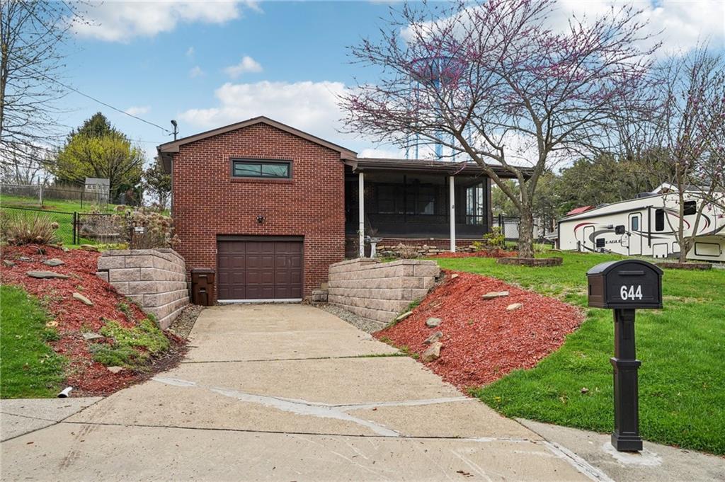 Widened Driveway and Keystone Block retaining wall.Home boasts 2 furnaces and 2 AC units