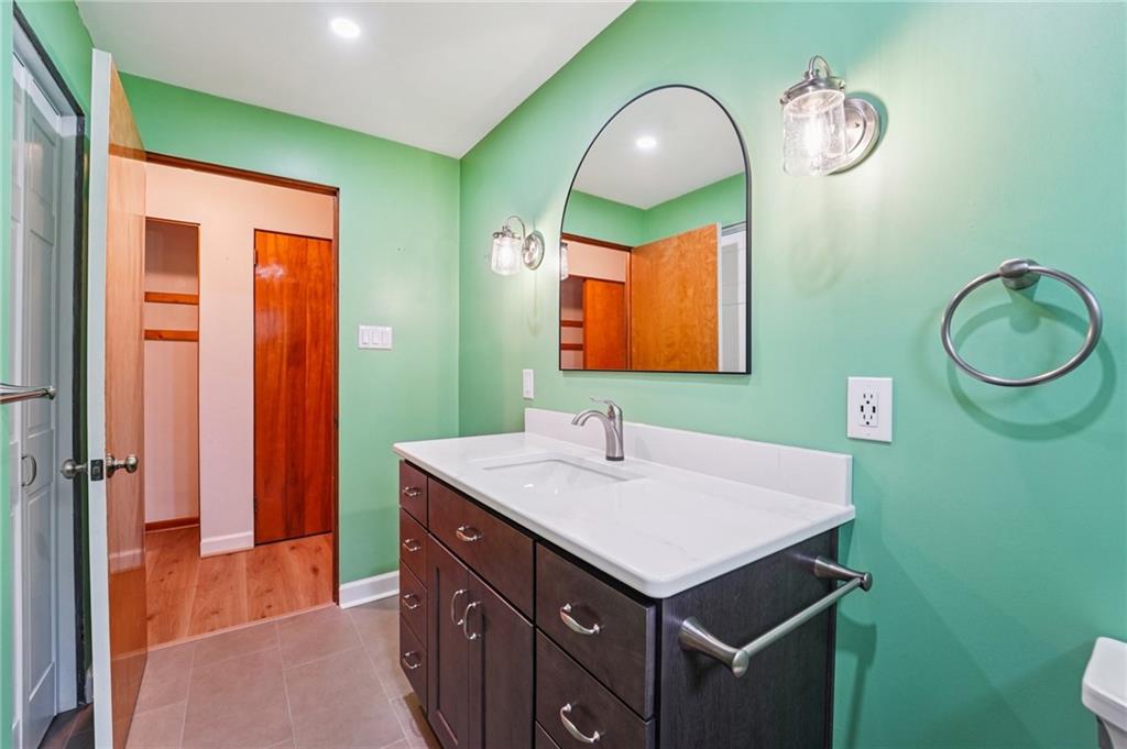 644 Grange Drive Apollo, PA 15613 - Photo 16 of 46 Totally remodeled bath room with new plumbing, new tiled shower electric vanity with marble top.