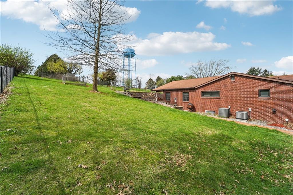 644 Grange Drive Apollo, PA 15613 - Photo 39 of 46 Chain link fence protect pets and tots. Gates are present too. Sidewalks encircle most of home. Beautiful Steps to back lawn