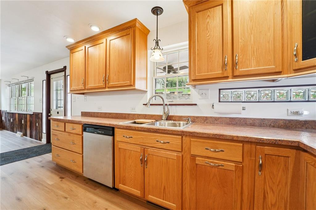 644 Grange Drive Apollo, PA 15613 - Photo 8 of 46 Pull out shelving, double pull-out Garbage bins, notice glassblock windows to brighten counter space