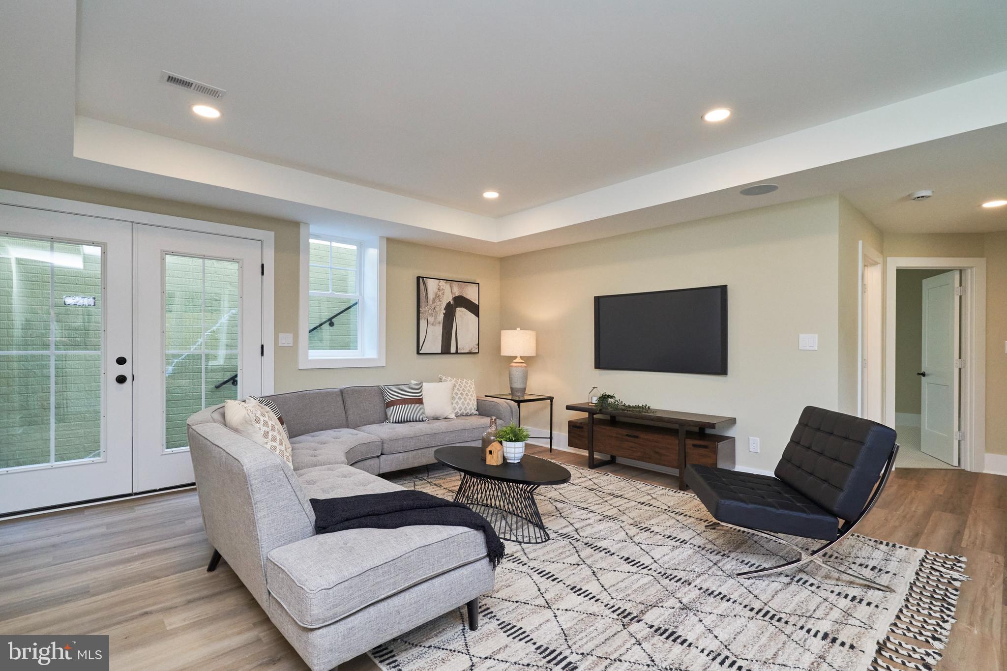 7019 Ridge Drive Alexandria, VA 22306 - Photo 38 of 67 Spacious lower level family room has side exit