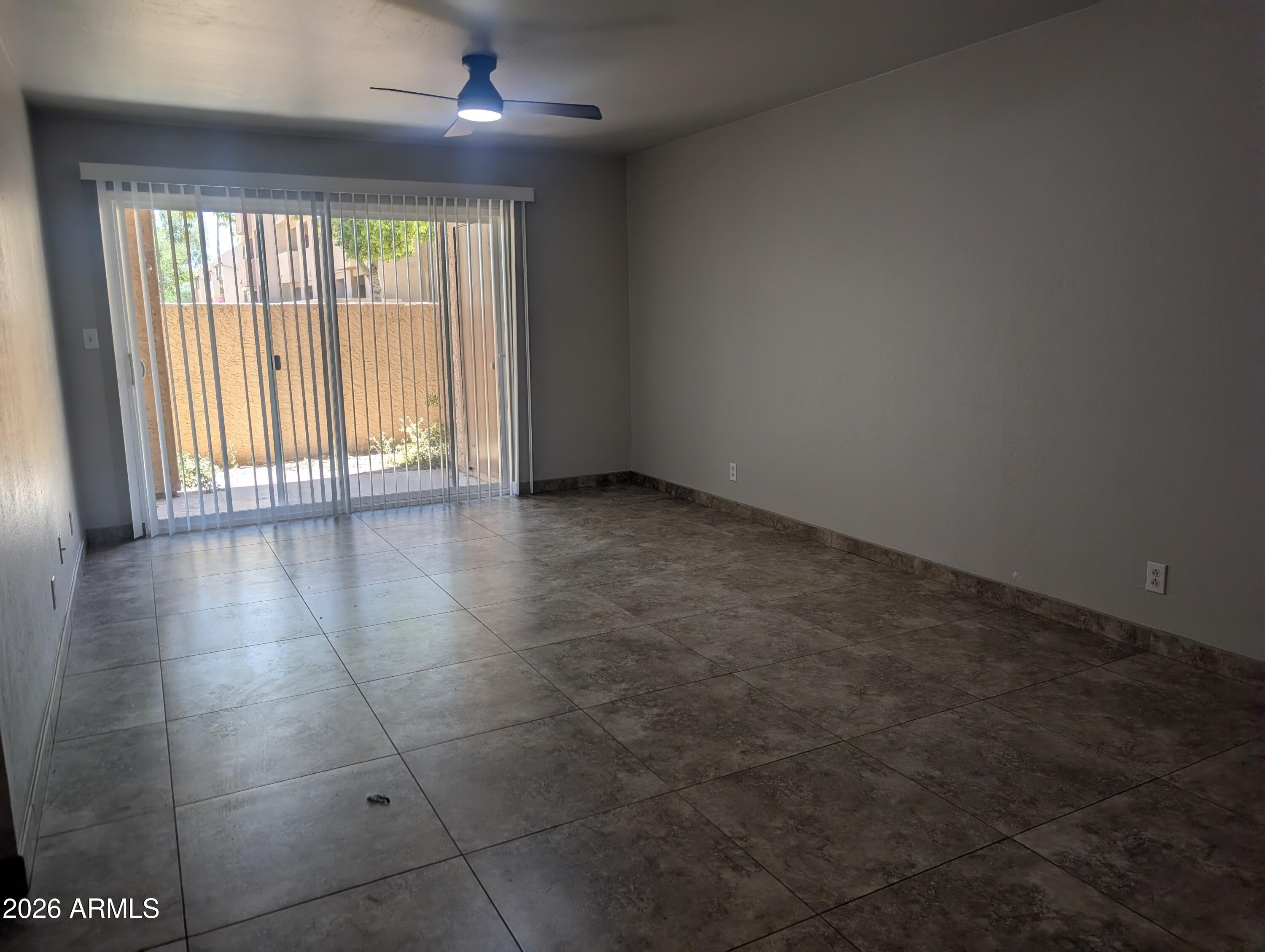 540 North May, Unit 1101 Mesa, AZ 85201 - Photo 6 of 15 Living room opens to back patio