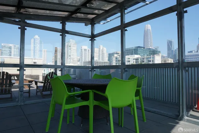 a view of a dining room with furniture and window