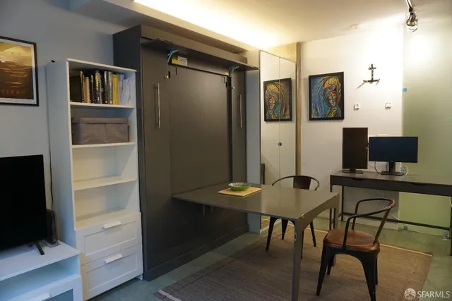 a view of a livingroom with furniture and wooden floor