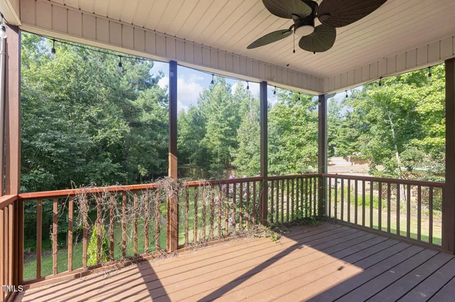 a view of balcony with wooden floor