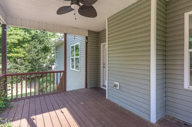 a view of a balcony with wooden floor