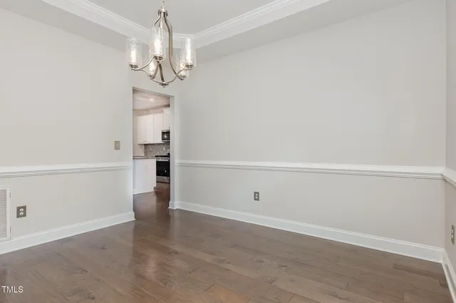 a view of a chandelier in an empty room