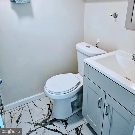 a bathroom with a toilet and a sink