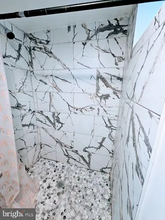 a view of wooden floor and chair in a room