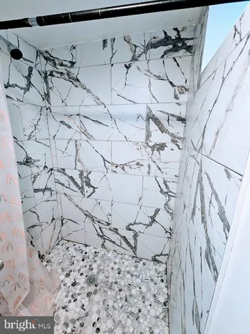 a view of wooden floor and chair in a room