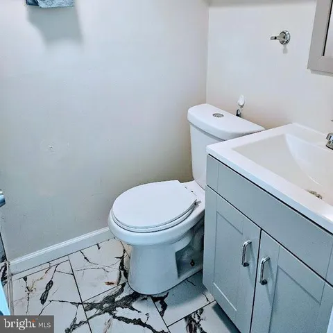 a bathroom with a toilet and a sink