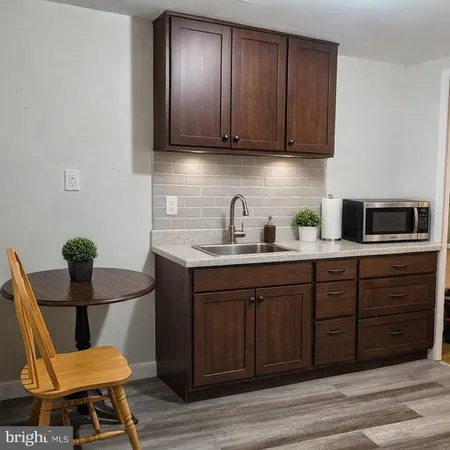 a view of room with workspace and mirror