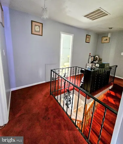 a view of a hallway with workspace