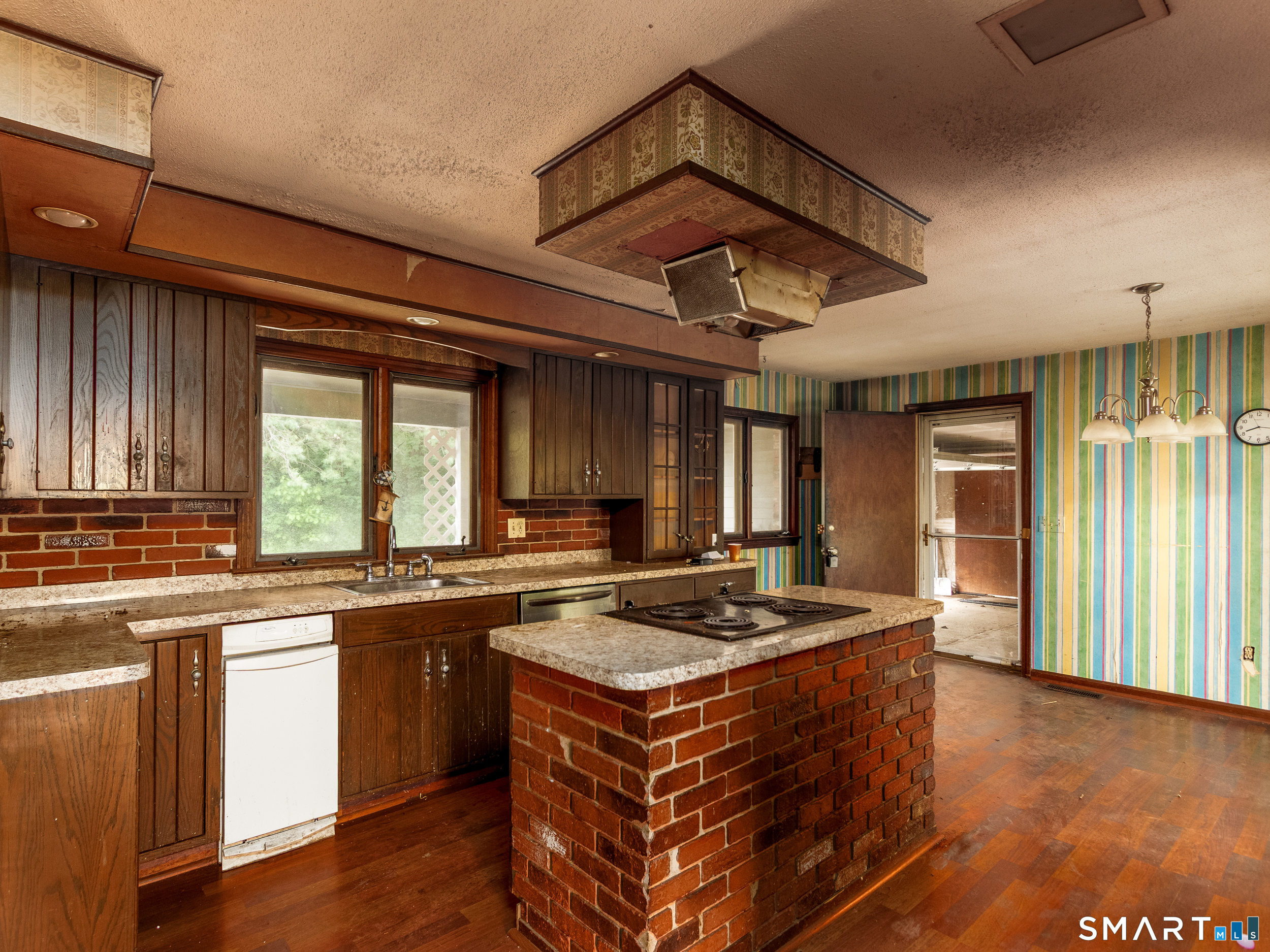 63 High Hill Road Wallingford, CT 06492 - Photo 11 of 34 a kitchen with a stove and a sink