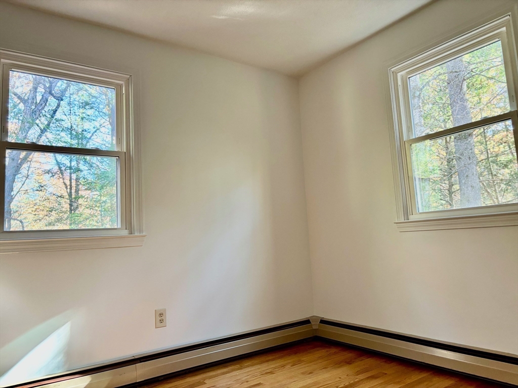 14 Pebble Ridge Road Amherst, MA 01002 - Photo 12 of 32 an empty room with a window