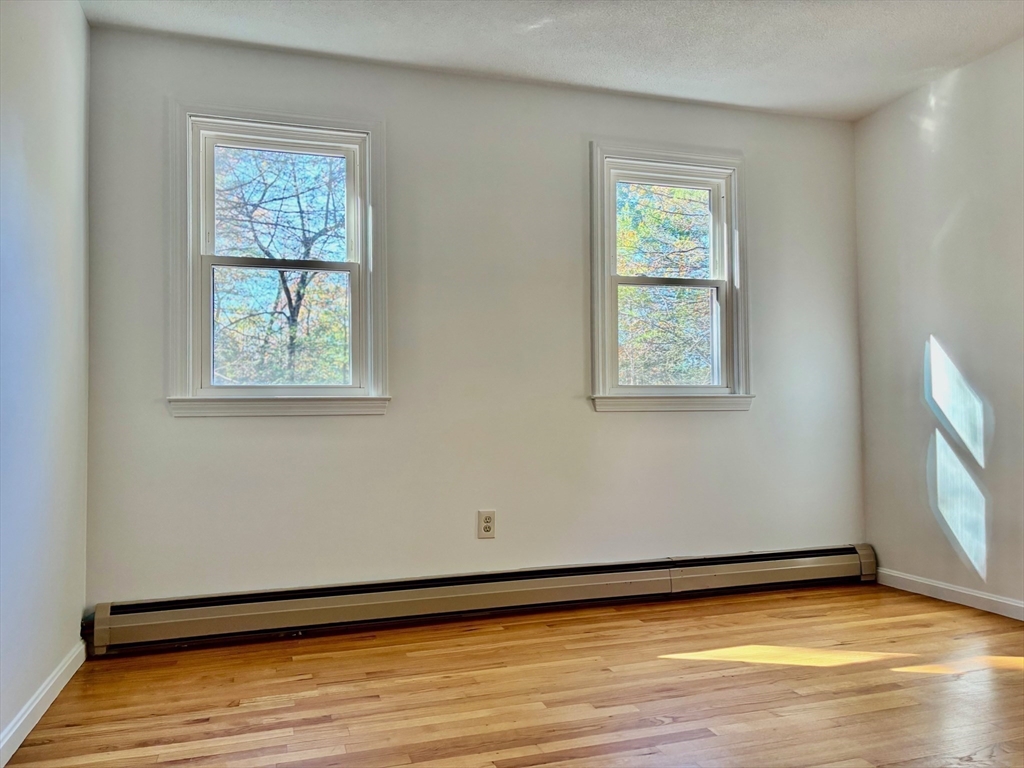 14 Pebble Ridge Road Amherst, MA 01002 - Photo 14 of 32 a view of an empty room with window